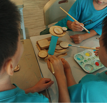Kids coloring at school together