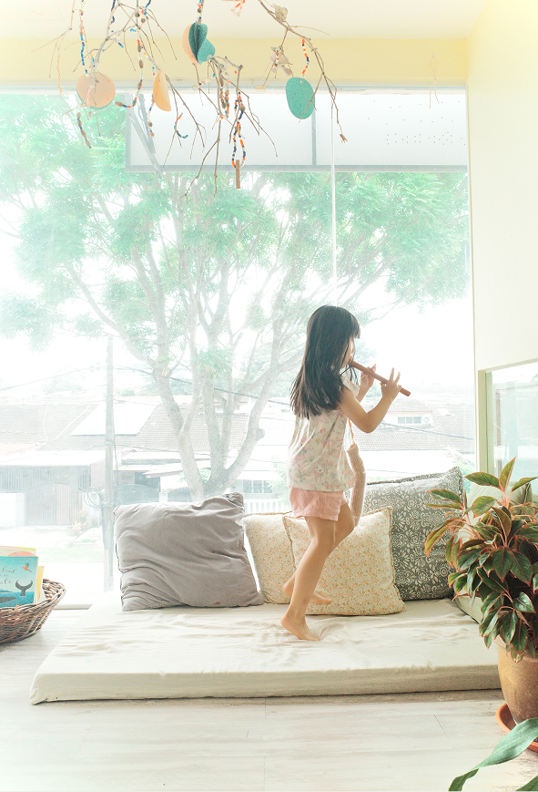 kid playing with flute